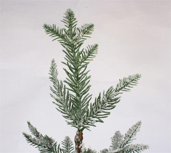 Small Christmas Decorations in Brown Paper Pot